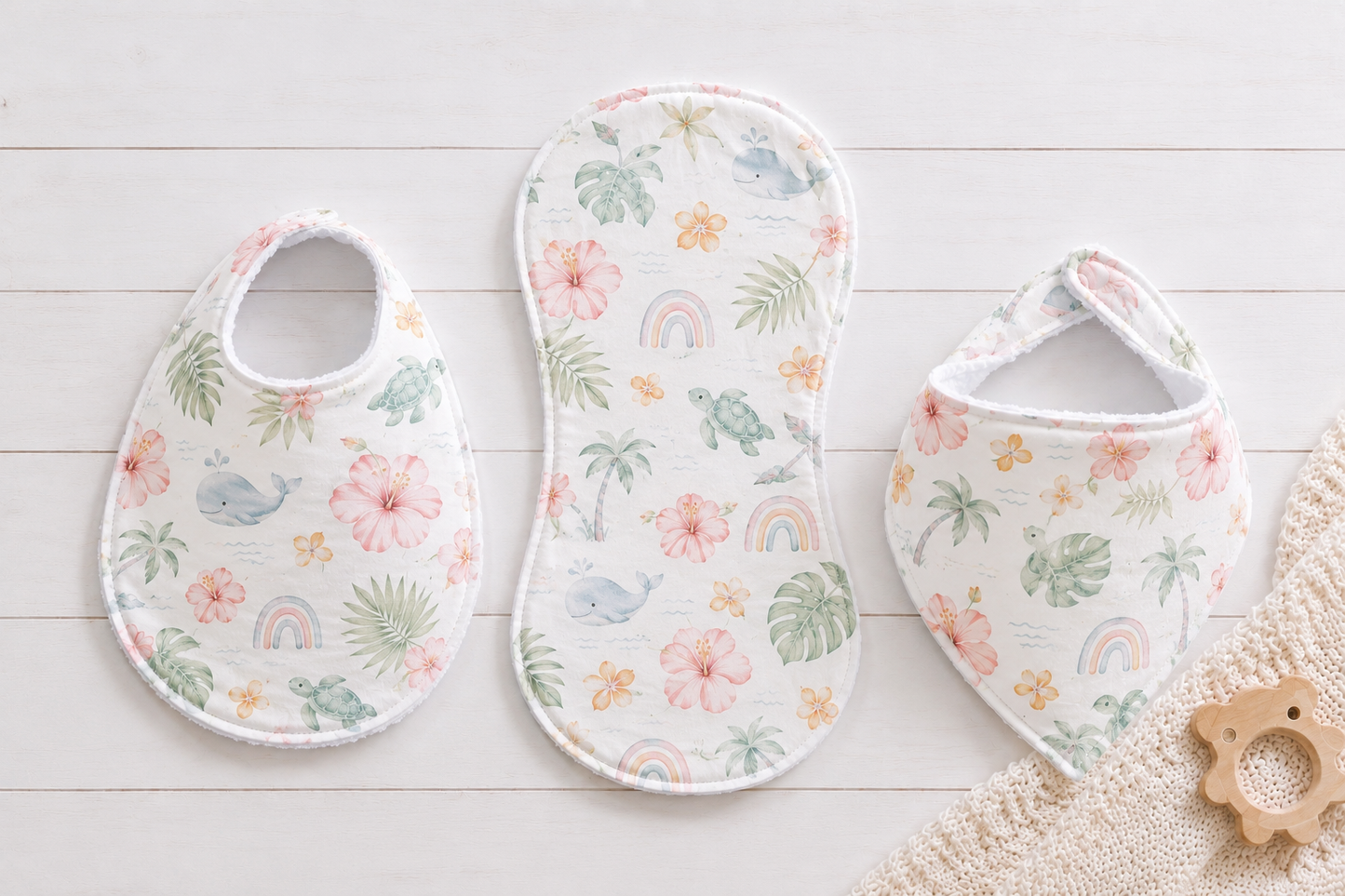 Traditional baby bib, bandana bib, and boutique burp cloth sewn in coordinating fabric from an easy printable PDF sewing pattern by Aloha Sewing Company.