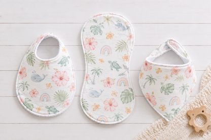 Traditional baby bib, bandana bib, and boutique burp cloth sewn in coordinating fabric from an easy printable PDF sewing pattern by Aloha Sewing Company.