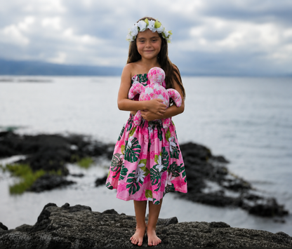Child holding the large Honu Sea Turtle Memory Plush made with the beginner-friendly PDF sewing pattern. Soft handmade stuffed sea turtle keepsake by aloha sewing company printable pattern.