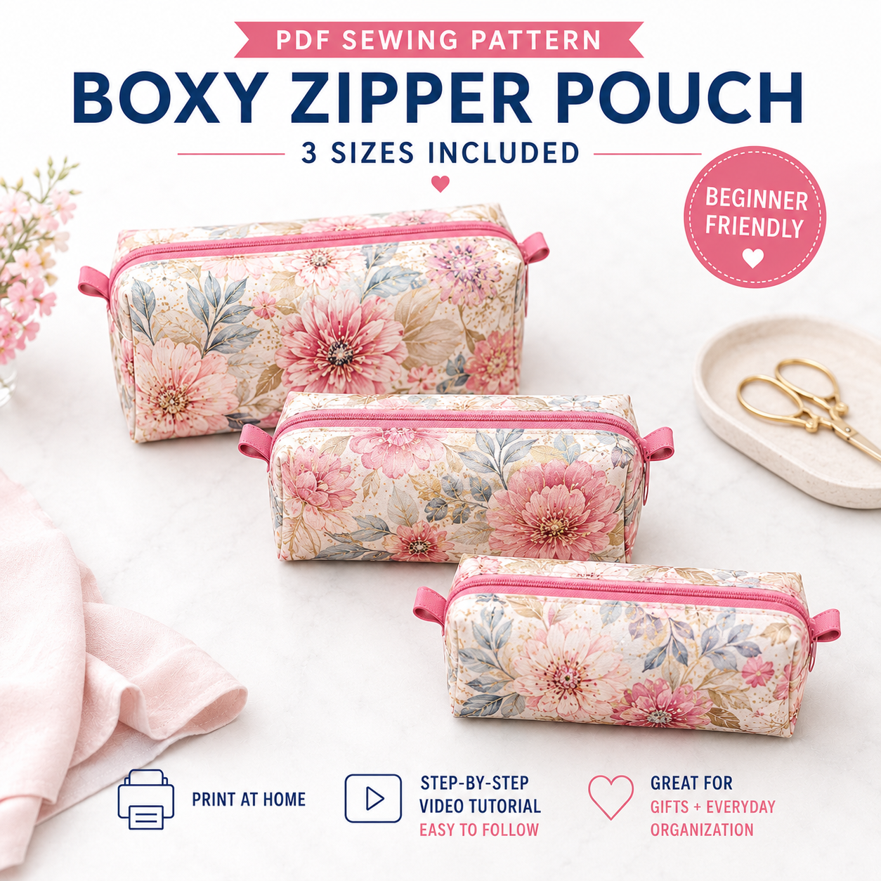 Promotional graphic for a PDF sewing pattern of a floral boxy zipper pouch, showing three fabric pouches in different sizes with pink zippers and a pink floral print. Text reads 'PDF SEWING PATTERN BOXY ZIPPER POUCH 3 SIZES INCLUDED' and includes 'BEGINNER FRIENDLY' and 'PRINT AT HOME' callouts.